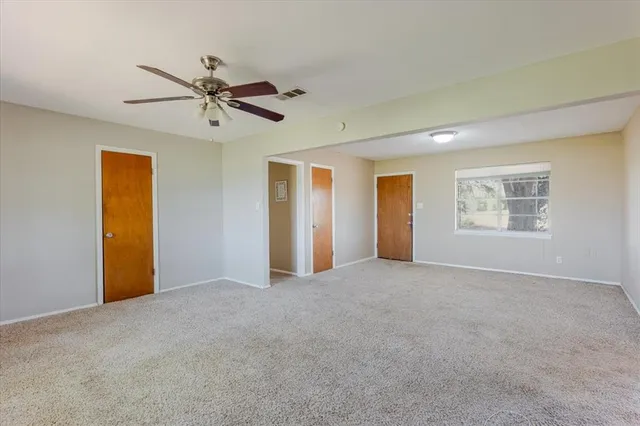 a view of empty room with windows