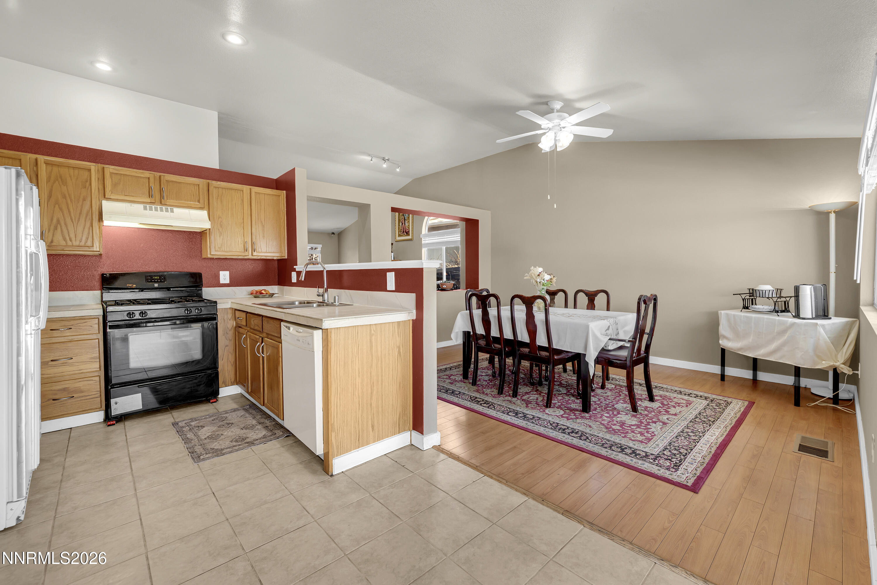 7951 Big River Drive Reno, NV 89506 - Photo 11 of 30 a kitchen with a stove a sink and a refrigerator