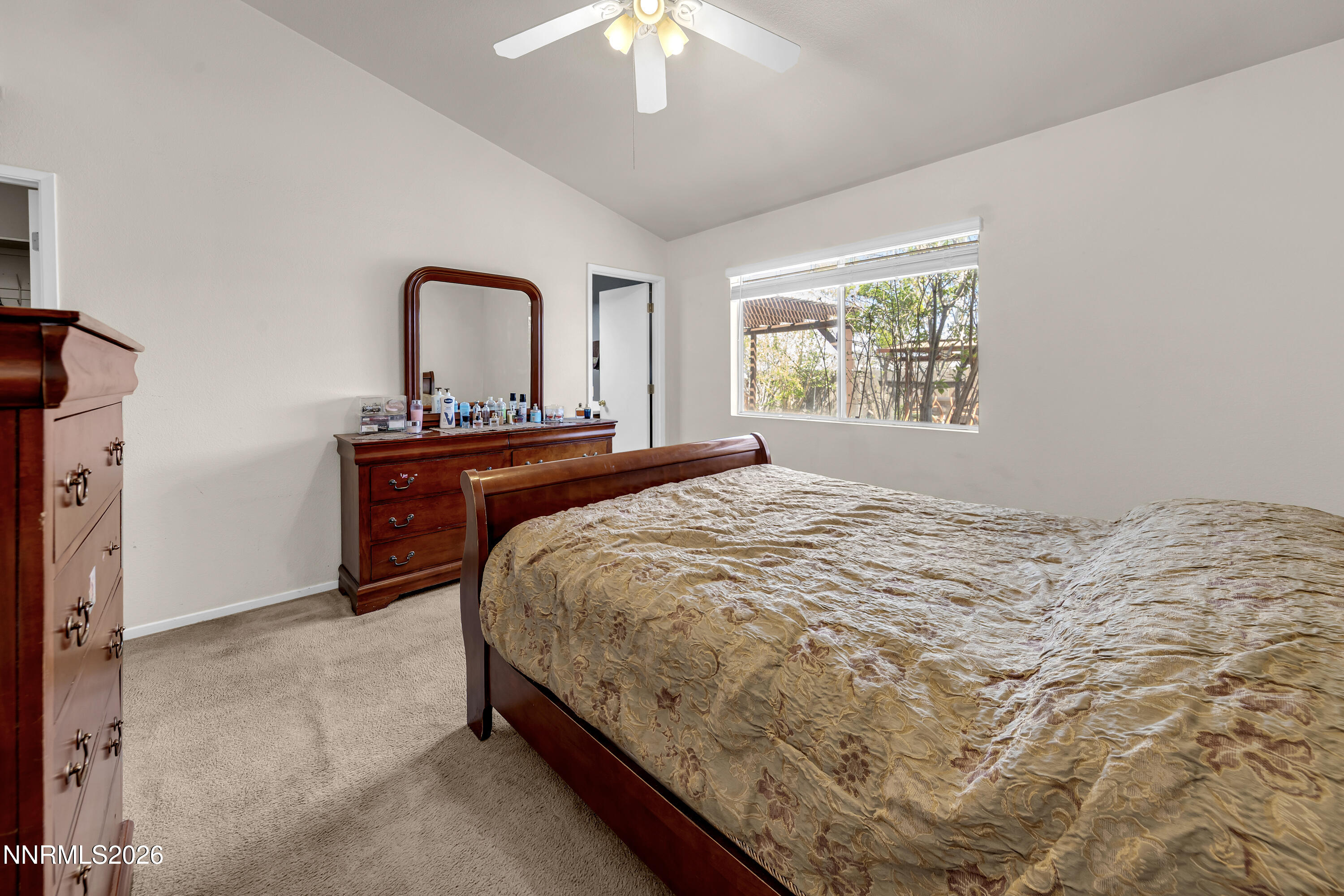 7951 Big River Drive Reno, NV 89506 - Photo 16 of 30 a bedroom with a bed and a chandelier