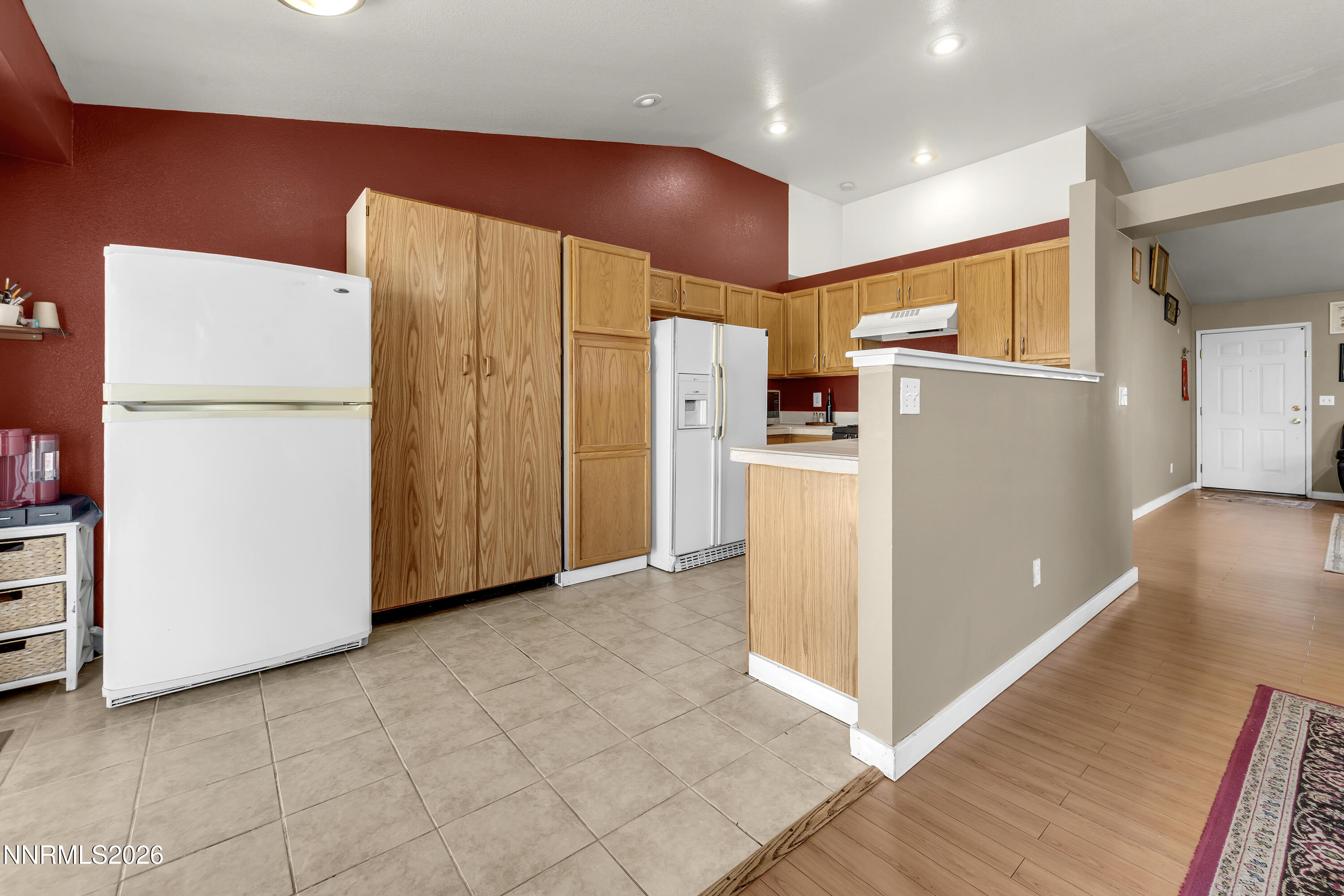 7951 Big River Drive Reno, NV 89506 - Photo 9 of 30 a view of a kitchen with a refrigerator a microwave and a sink