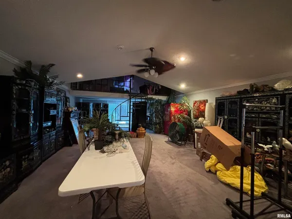 a view of a patio with dining table and chairs with a flat screen tv