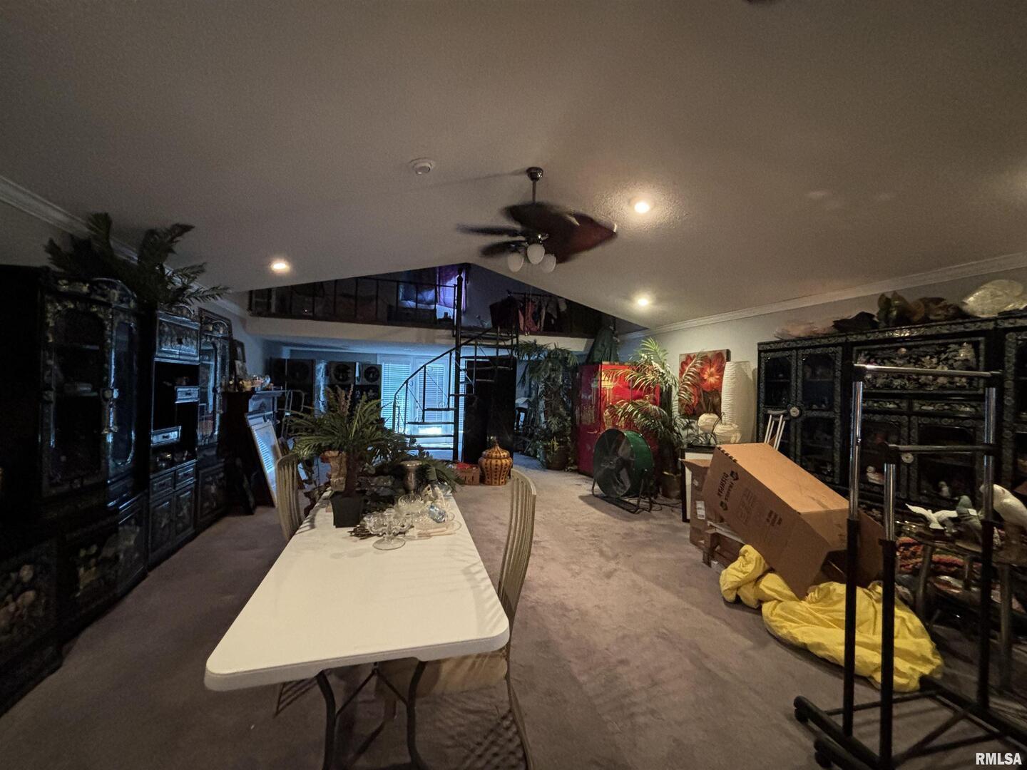 203 East 4th Street Brookport, IL 62910 - Photo 13 of 15 a view of a patio with dining table and chairs with a flat screen tv