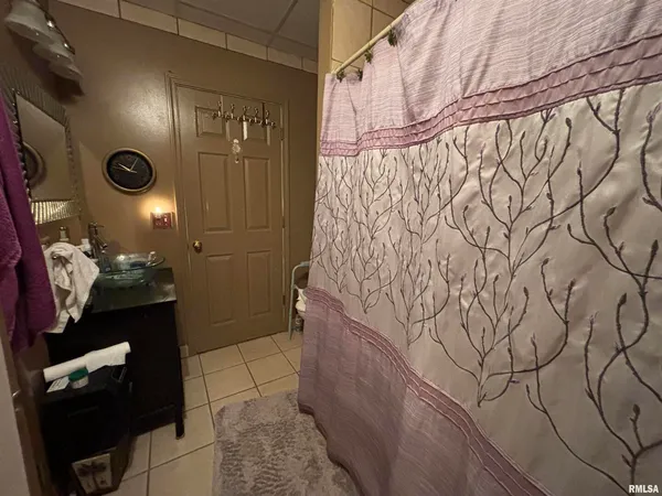a bathroom with a sink and mirror