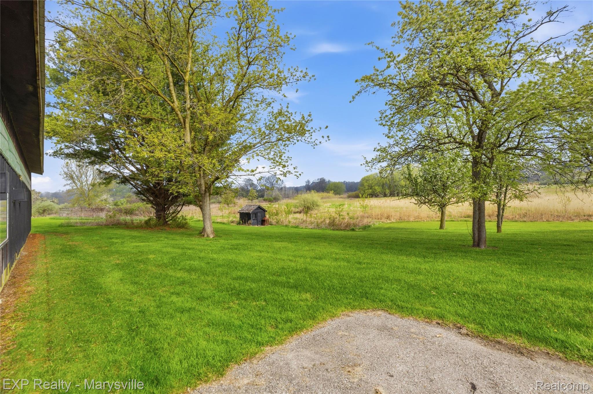 3345 Beach Road Port Huron, MI 48060 - Photo 45 of 89 View of grassy yard with an outbuilding