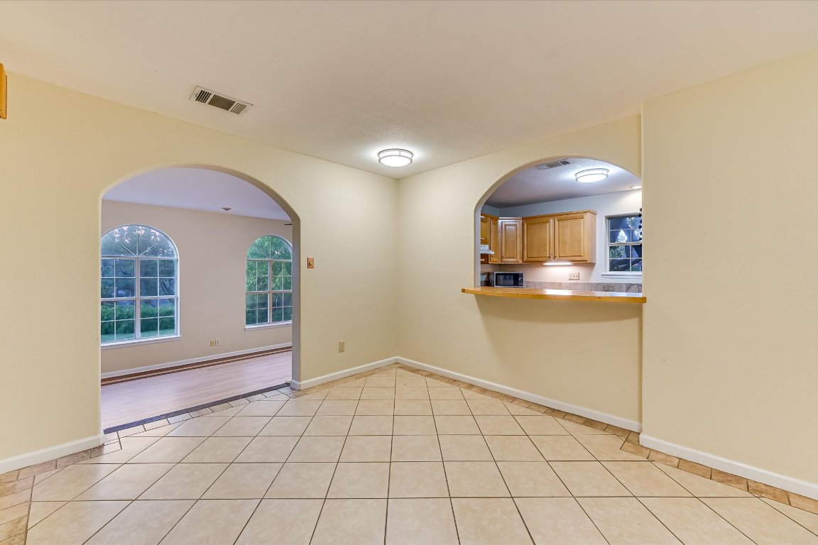 2405 Bahama Road Austin, TX 78733 - Photo 19 of 38 Empty room with baseboards and light tile patterned floors