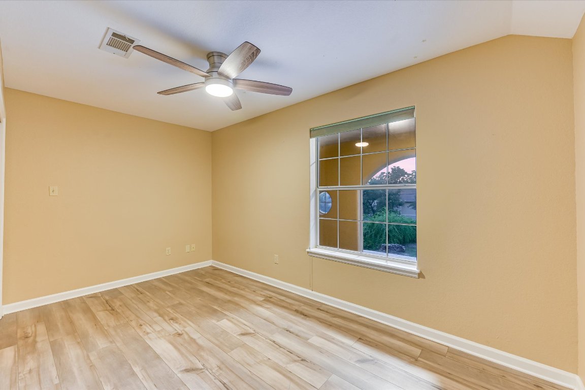 2405 Bahama Road Austin, TX 78733 - Photo 24 of 38 Spare room featuring wood finished floors and a ceiling fan