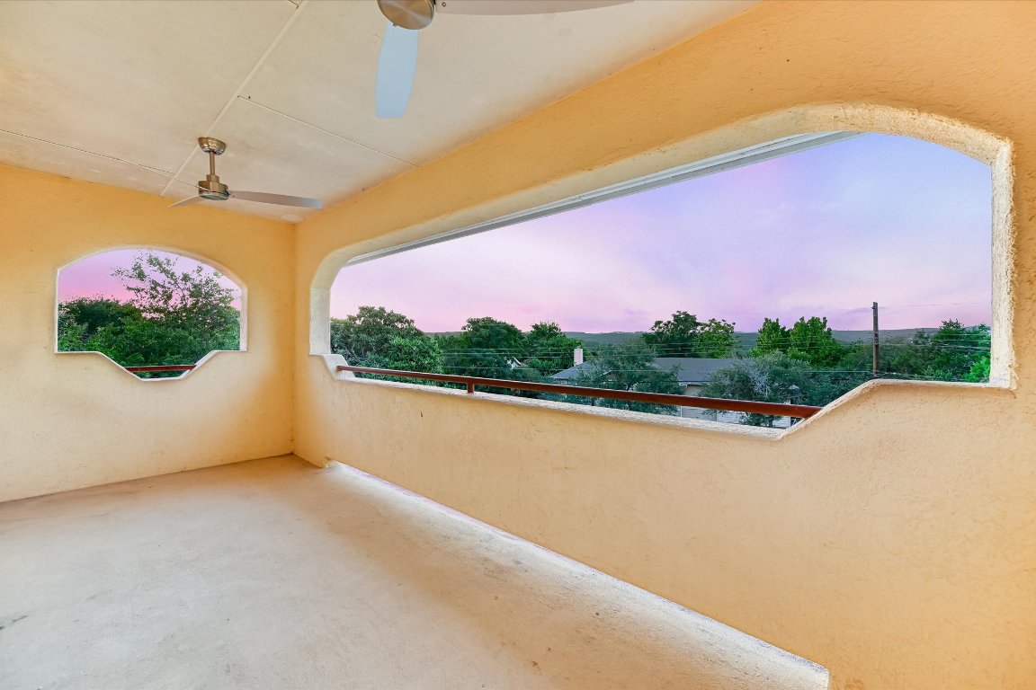 2405 Bahama Road Austin, TX 78733 - Photo 25 of 38 Balcony featuring a ceiling fan