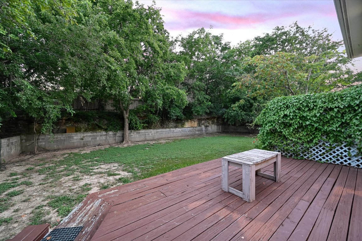 2405 Bahama Road Austin, TX 78733 - Photo 26 of 38 Deck at dusk featuring a fenced backyard