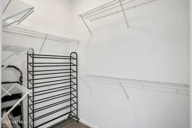a view of a room with racks on the wall