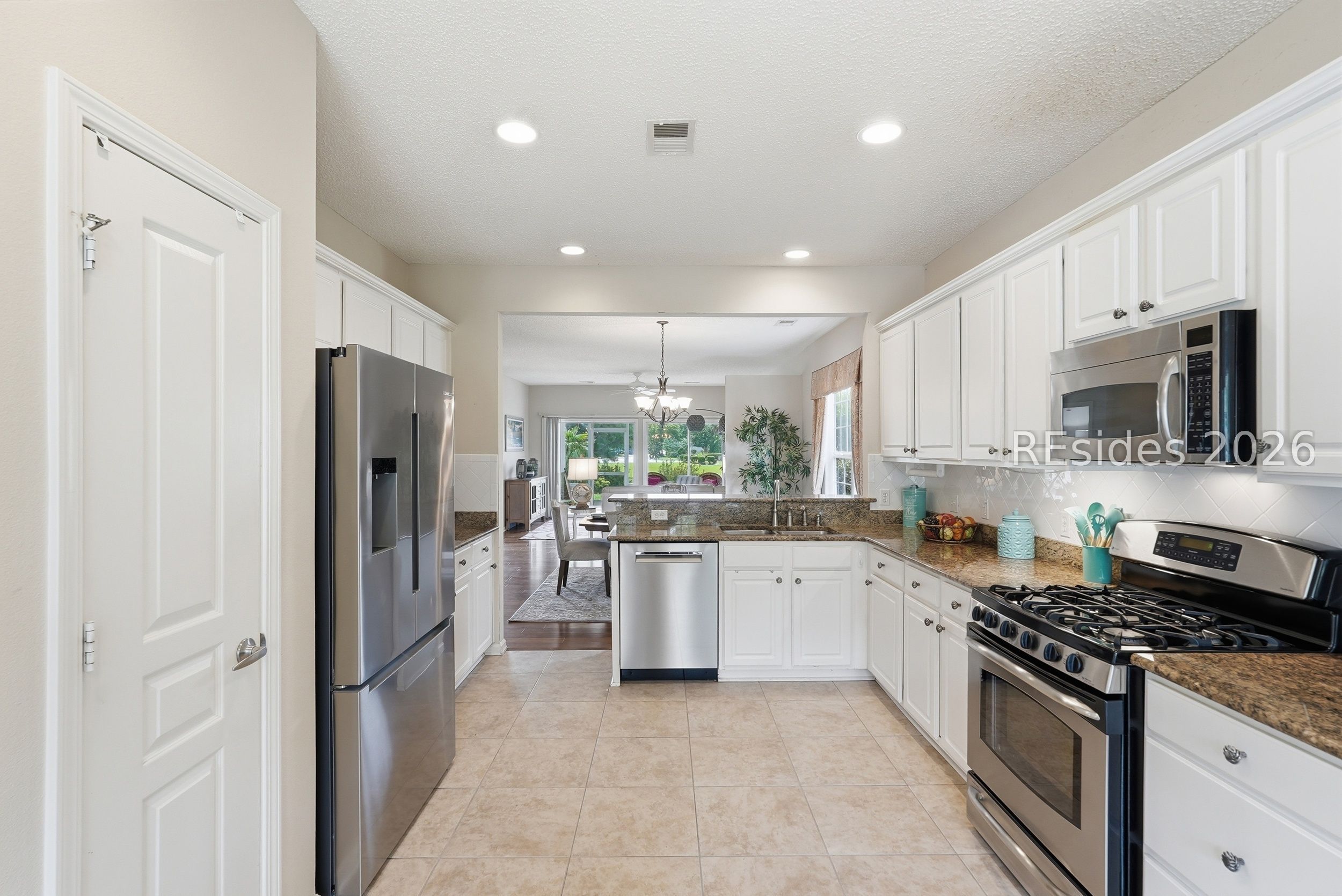 65 Holly Ribbons Circle Bluffton, SC 29909 - Photo 15 of 84 White cabinetry & tile backsplash.