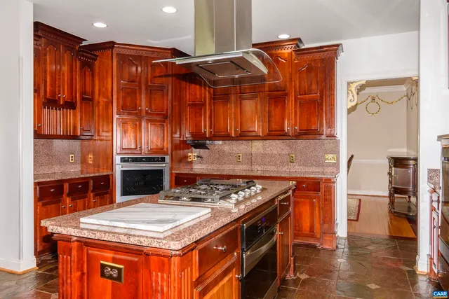 a dining room with furniture a rug and wooden floor