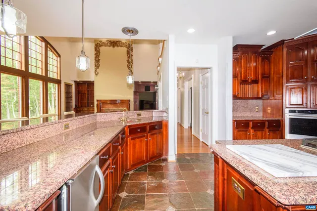 a view of a dining room with furniture wooden floor and chandelier