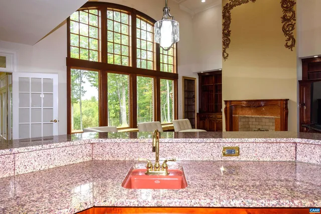 a view of a livingroom with wooden floor and furniture