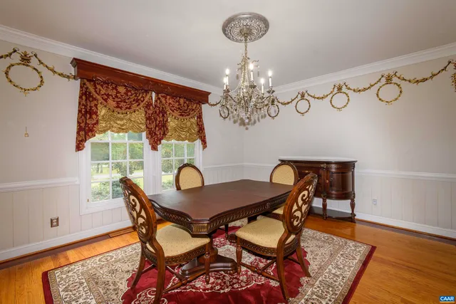 a view of a livingroom with wooden floor and window