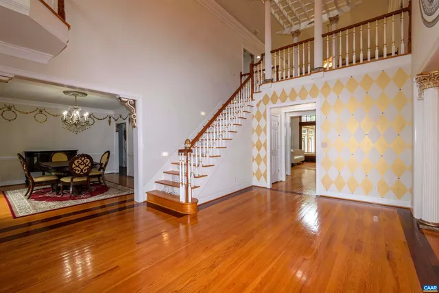 a bedroom with a bed closet and a large window