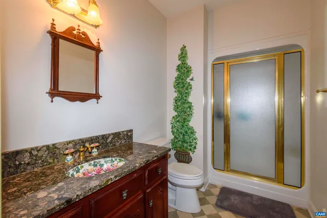 a view of a room with a window and ceiling fan