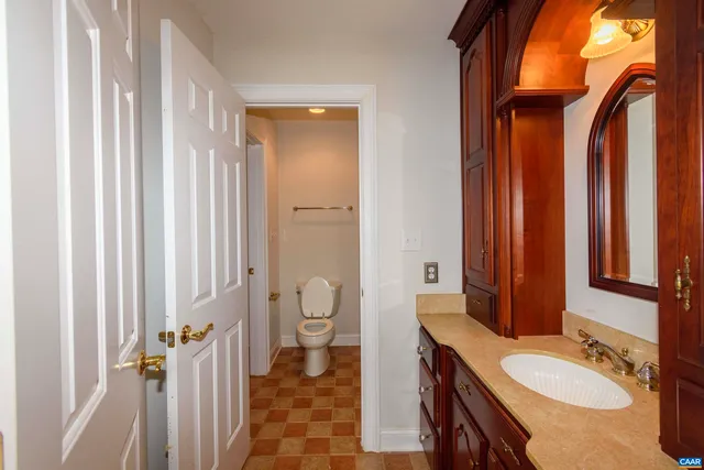 a view of a hallway with entryway wooden floor and front door