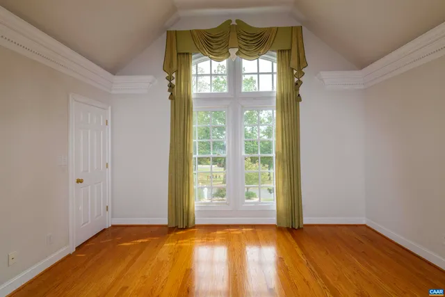 a kitchen with stainless steel appliances granite countertop a sink a stove and a window