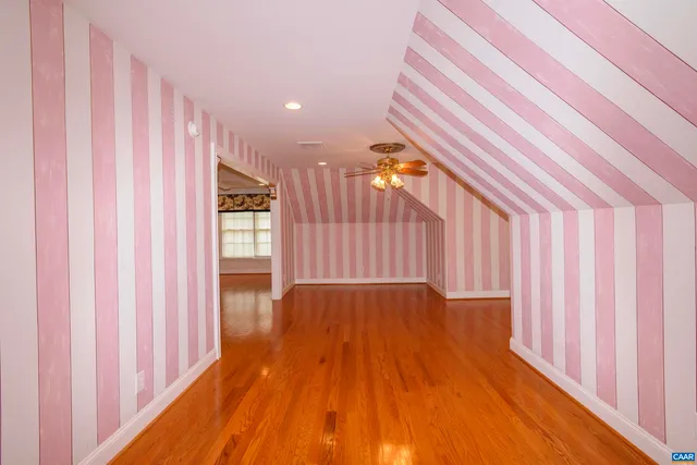an aerial view of a house with swimming pool and porch