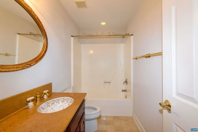 an aerial view of a house with swimming pool garden and patio