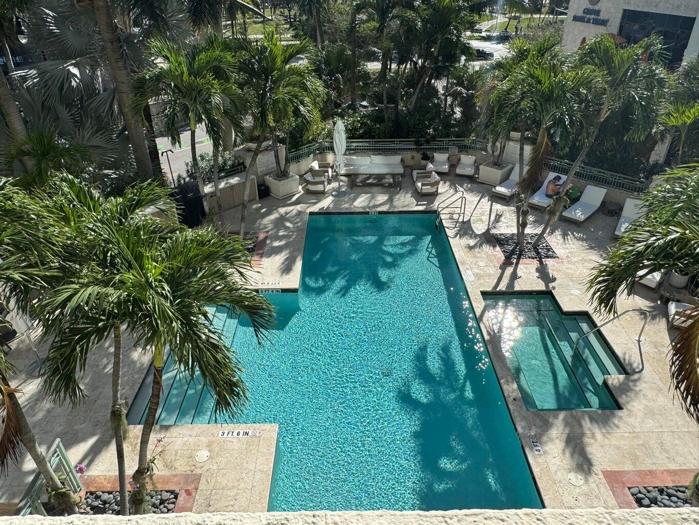 3400 Southwest 27th Avenue, Unit 303 Miami, FL 33133 - Photo 11 of 12 a view of yard with swimming pool and sitting area