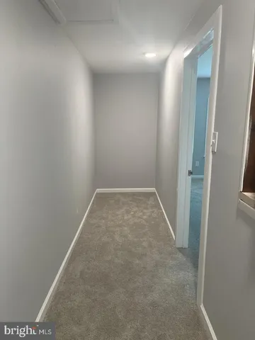 an empty room with a hallway