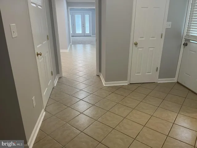 an empty room with wooden floor