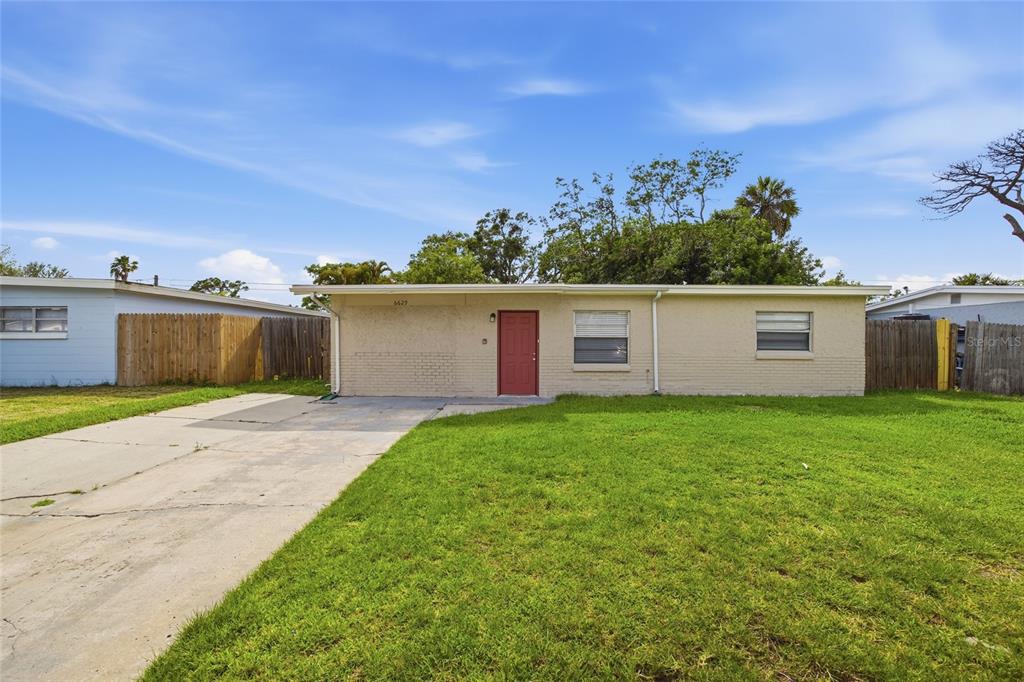 6629 Sierra Terrace New Port Richey, FL 34652 - Photo 1 of 30 a view of a yard with a house