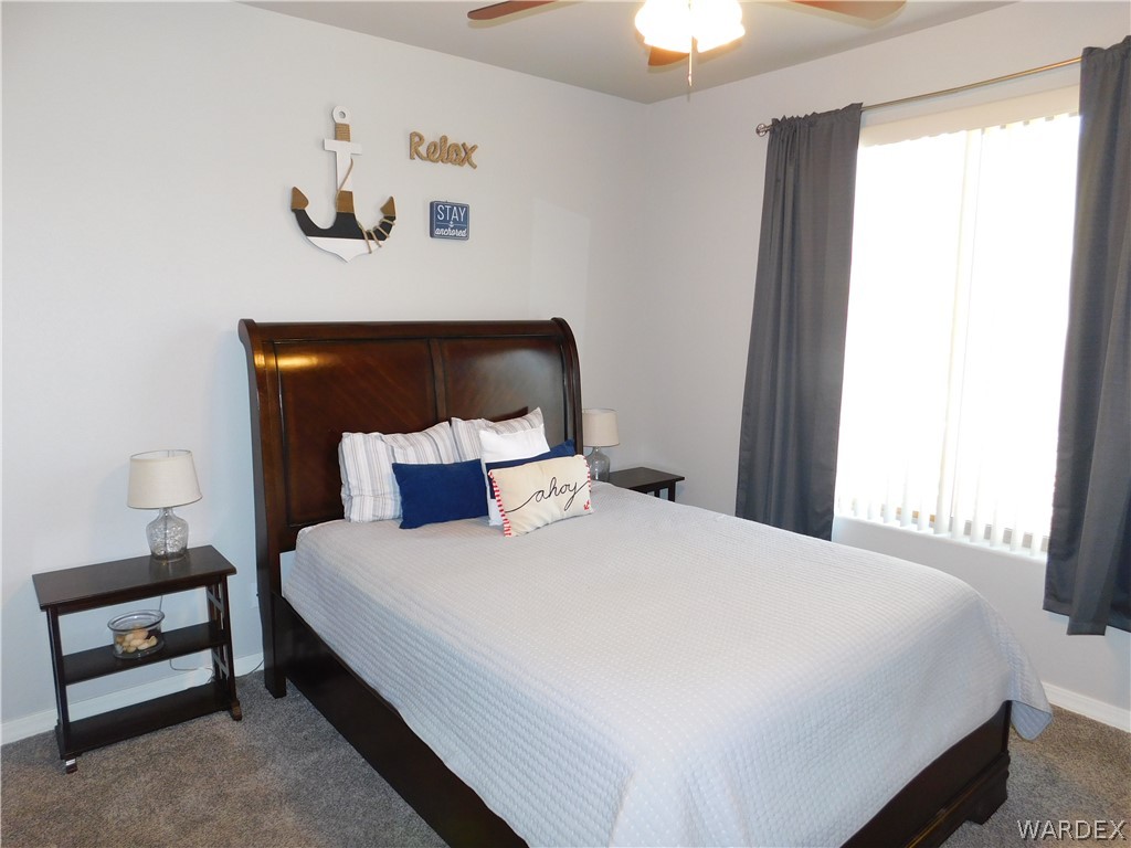 3370 South Ridge Avenue Bullhead City, AZ 86429 - Photo 44 of 56 a bedroom with a bed and a window