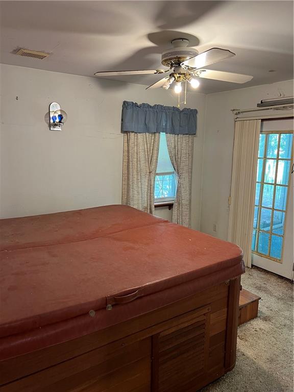 1023 Wetzel Road Pittsburgh, PA 15209 - Photo 8 of 11 a room with a bed and a chandelier