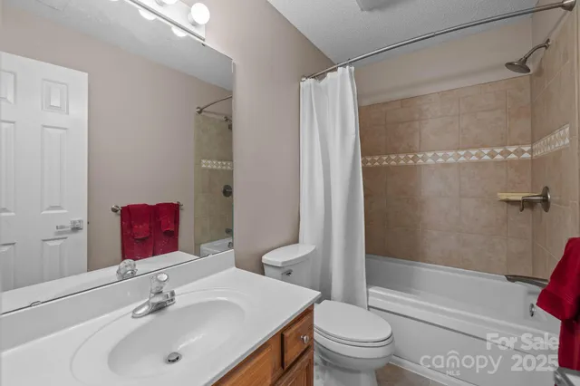 a bedroom with a bed and a table in it