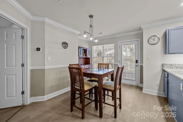 a view of a dining room with furniture and window