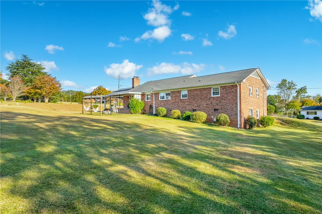 401 South Glassy Mountain Road Pickens, SC 29671 - Photo 32 of 37 This spacious property offers a serene backyard retreat, perfect for relaxation and outdoor enjoyment.