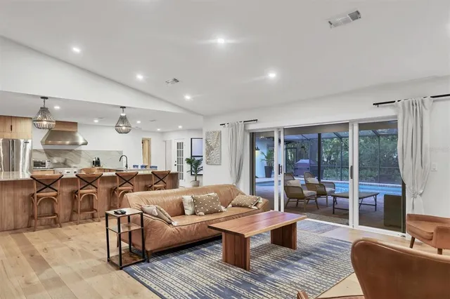a large kitchen with lots of counter space and stainless steel appliances