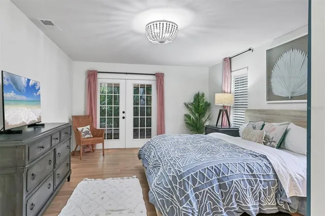 an aerial view of a house with a yard and garden