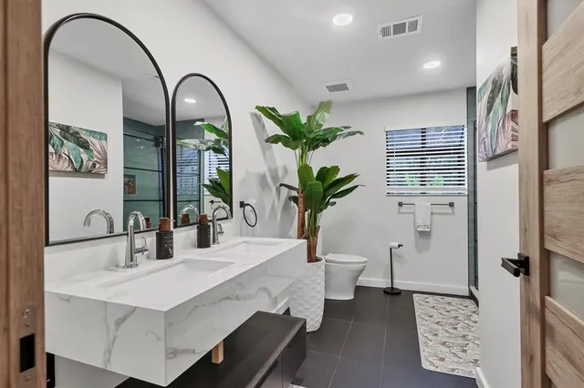 a house that has a tree in front of it