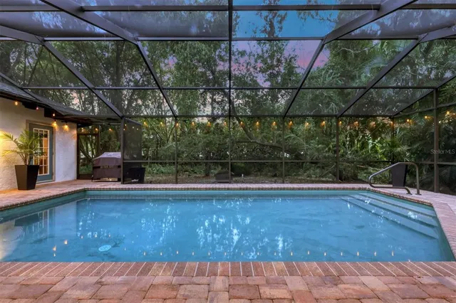a outdoor space with lots of chairs and a table