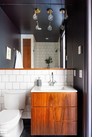 a bedroom with a large bed and a large window