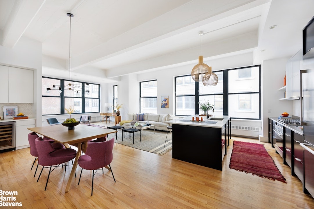1 Main Street, Unit 5H Brooklyn, NY 11201 - Photo 4 of 17 a living room with furniture a wooden floor and large window