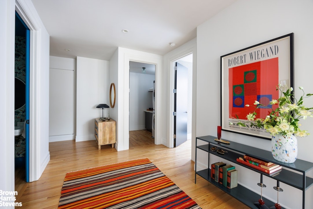 1 Main Street, Unit 5H Brooklyn, NY 11201 - Photo 7 of 17 a living room with furniture and a flat screen tv