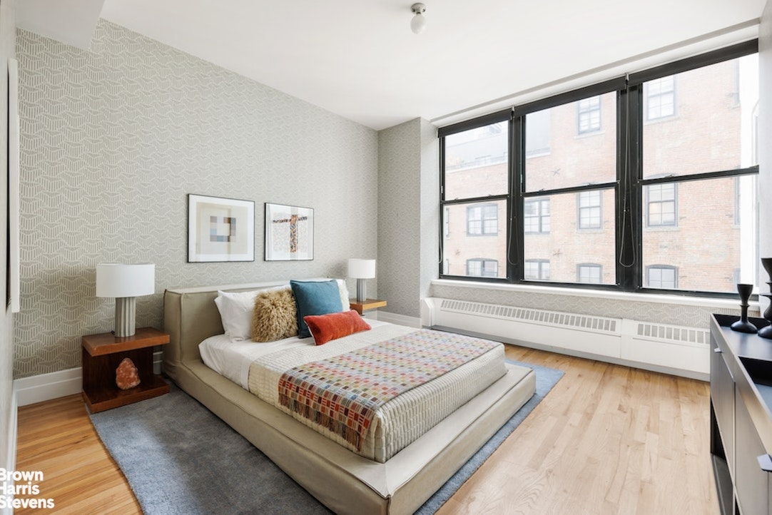 1 Main Street, Unit 5H Brooklyn, NY 11201 - Photo 9 of 17 a bedroom with a large bed and a large window