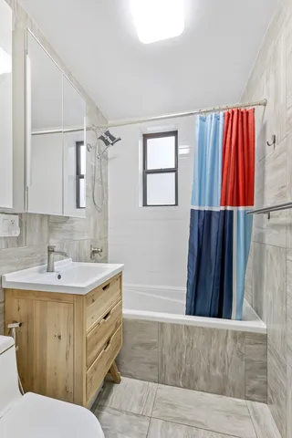 a bedroom with a bed and a bookshelf