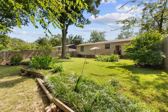 a backyard of a house with lots of green space