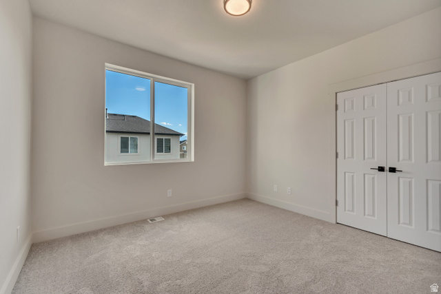 2535 West Santa Fe Drive Mapleton, UT 84664 - Photo 15 of 26 Unfurnished bedroom with carpet floors and a closet