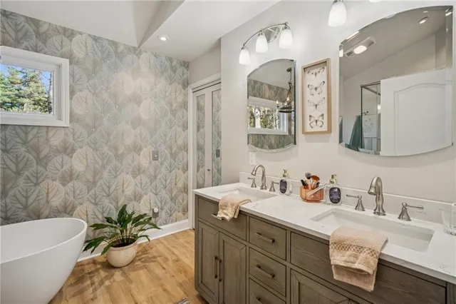 a bathroom with a bathtub and shower