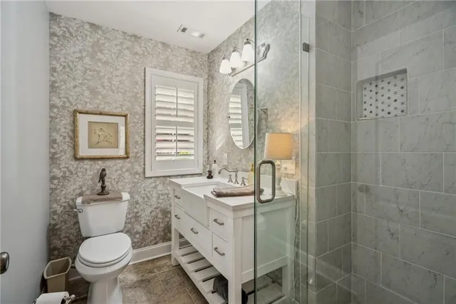 a bathroom with a shower and a sink