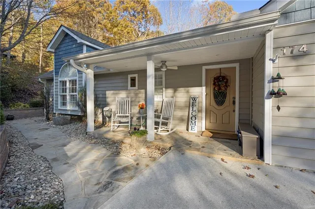 a living room with furniture a window and a clock