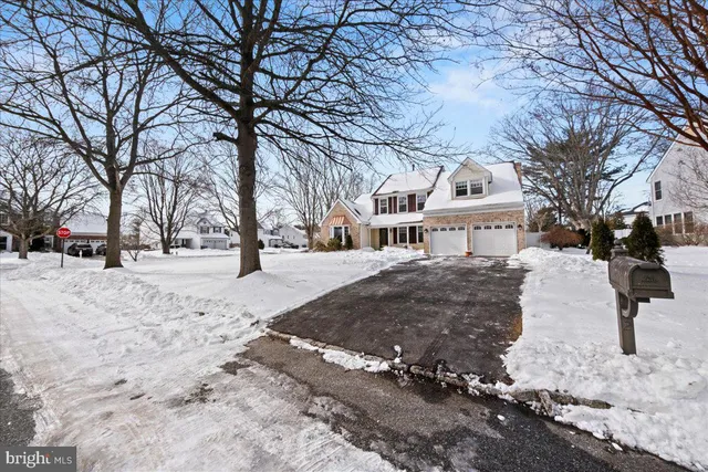 a view of house with trees in snow