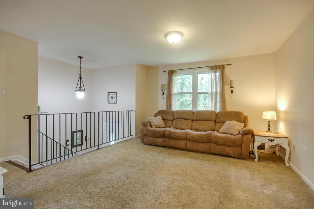 121 Plum Point Road Huntingtown, MD 20639 - Photo 3 of 30 a living room with furniture and a window