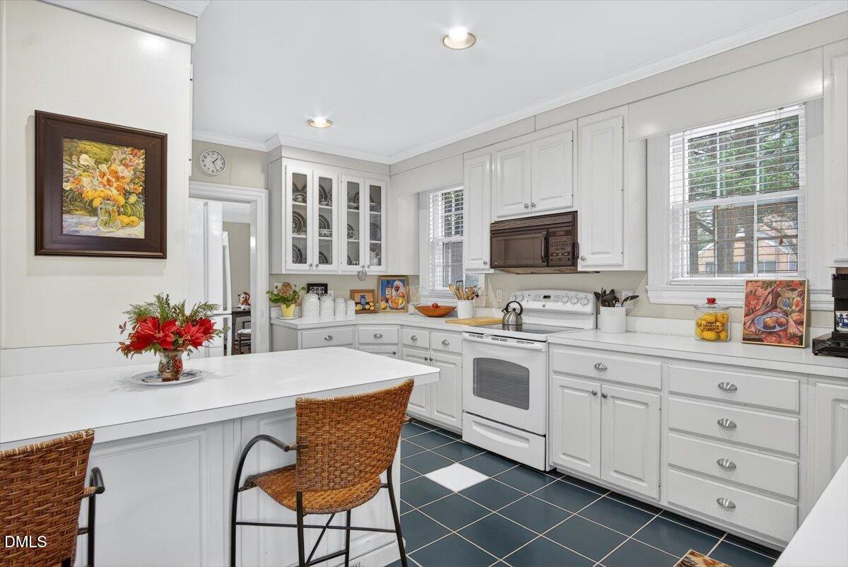 2064 Oxford Road Henderson, NC 27536 - Photo 17 of 68 a kitchen with stainless steel appliances a sink window and cabinets